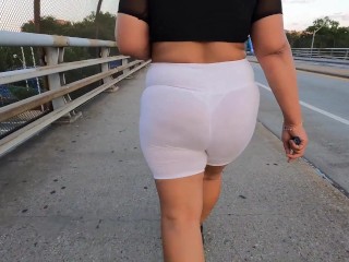 White see through shorts with white thong walking