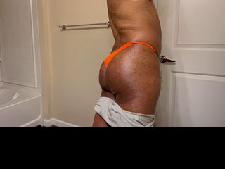 Orange thong and smooth ass
