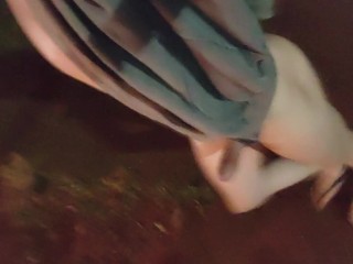 Femboy walks outdoors naked
