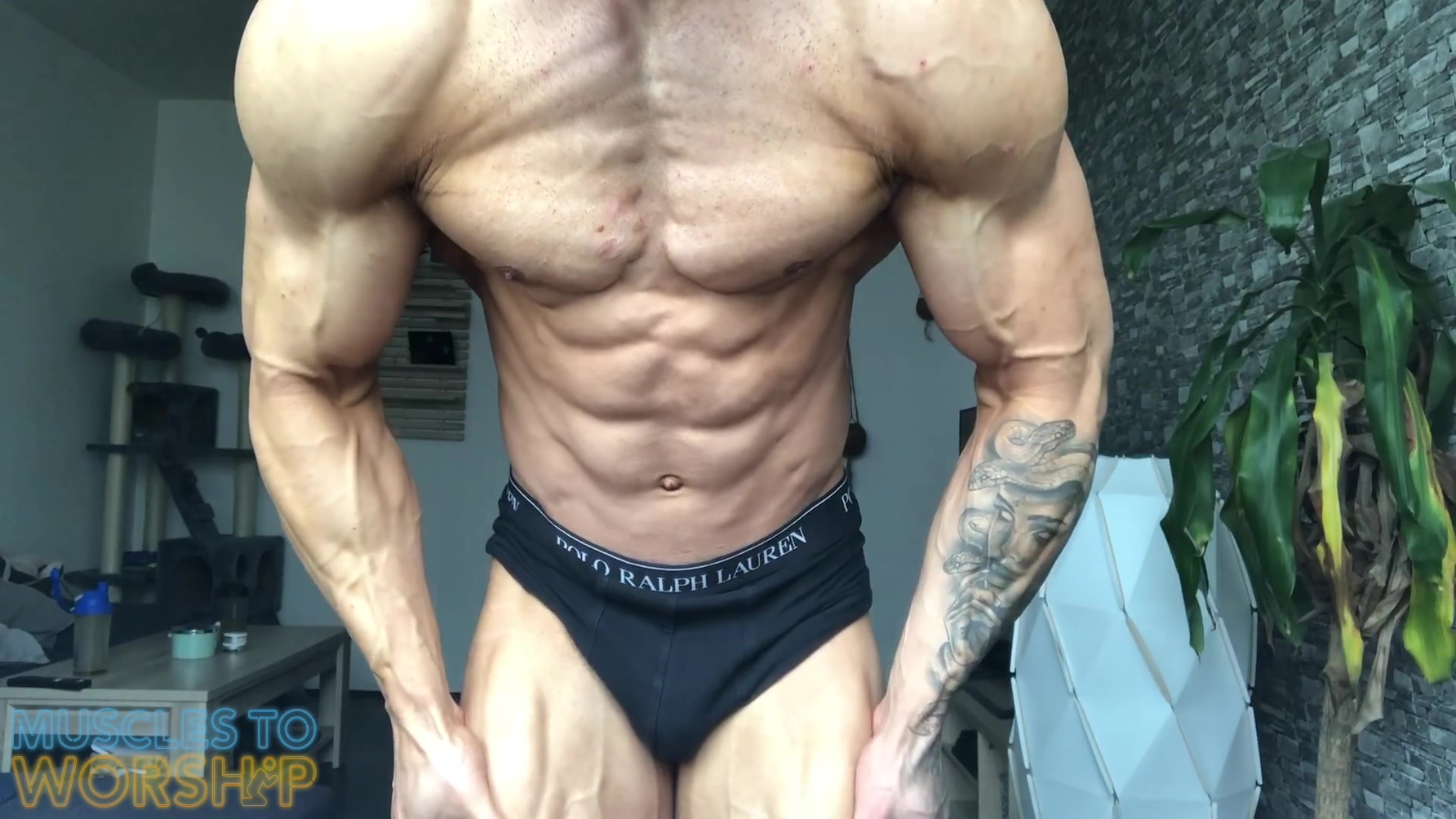 College Wrestler Flexes Muscles